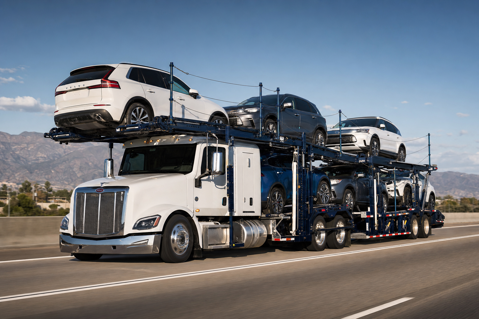 A side view of a stinger-steer auto carrier truck transporting multiple vehicles along a highway.